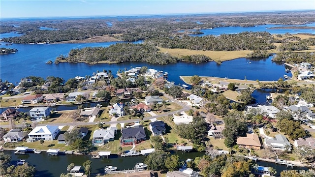 drone / aerial view featuring a water view and a residential view