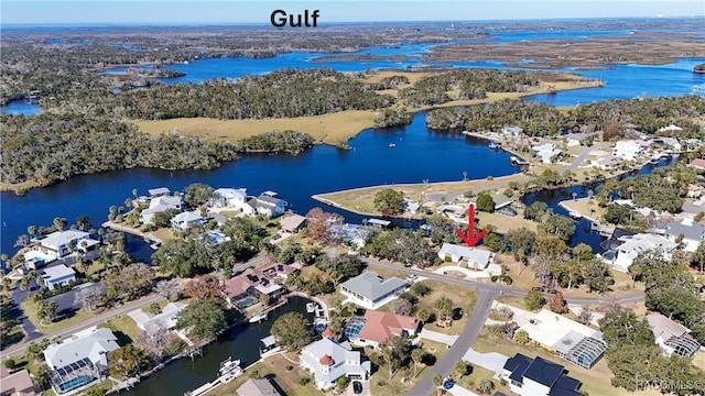 birds eye view of property featuring a water view and a residential view