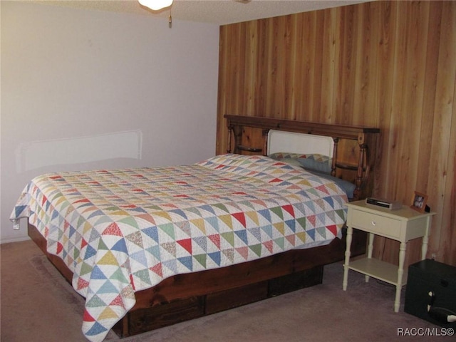 5198 N Sierra Vista Dr, Crystal River, FL 34428 - bedroom featuring wood walls and carpet flooring