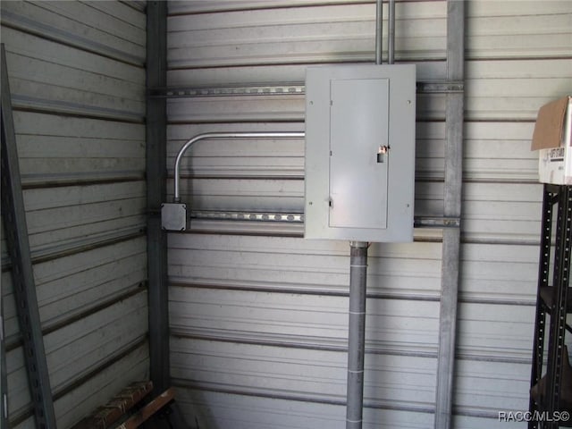 5198 N Sierra Vista Dr, Crystal River, FL 34428 - garage featuring wood walls and electric panel