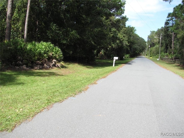 5198 N Sierra Vista Dr, Crystal River, FL 34428 - view of asphalt street featuring street lights