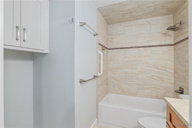 full bathroom featuring vanity, toilet, and tiled shower / bath