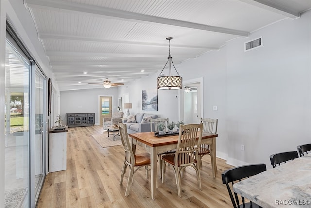 dining space featuring vaulted ceiling with beams, ceiling fan, and light hardwood / wood-style floors