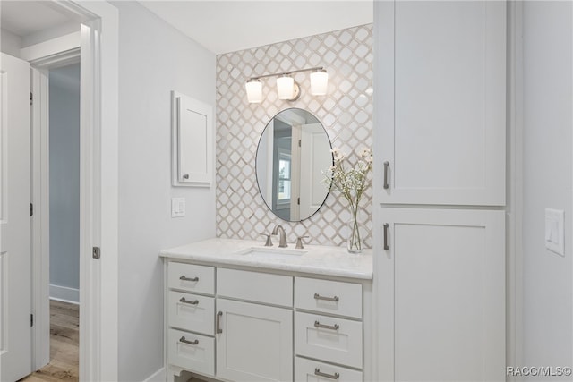 bathroom with hardwood / wood-style flooring and vanity