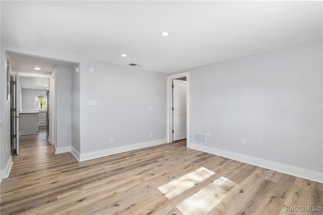 unfurnished room featuring light hardwood / wood-style floors