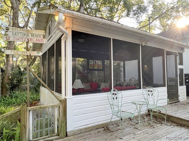 deck with a sunroom