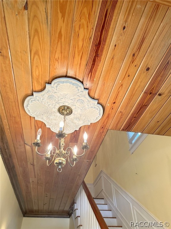 interior details with wooden ceiling and a notable chandelier