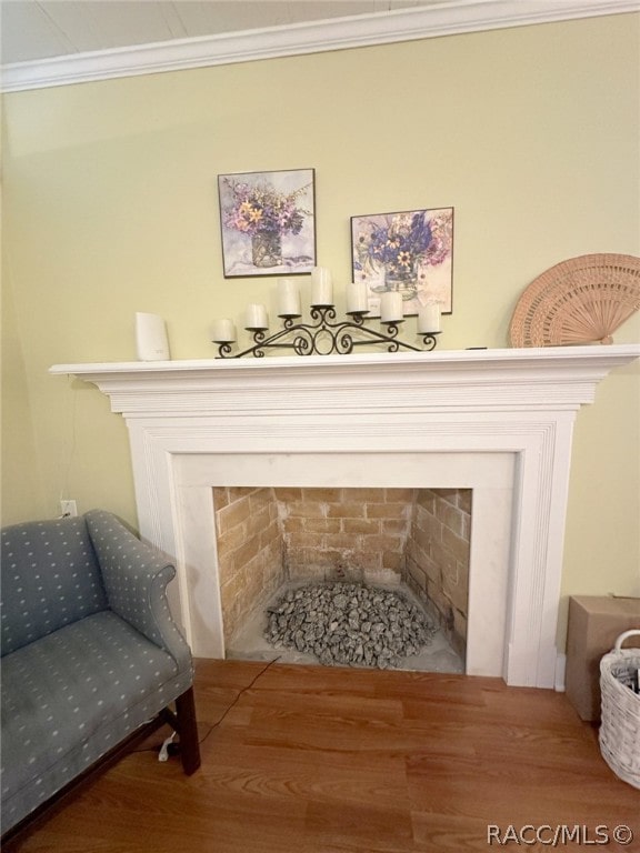 details with hardwood / wood-style floors and ornamental molding