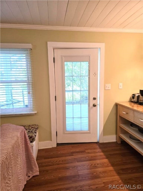 doorway with dark hardwood / wood-style floors, ornamental molding, and wood ceiling