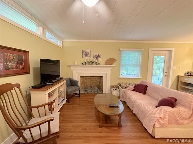 living room with wooden ceiling, light hardwood / wood-style flooring, and crown molding