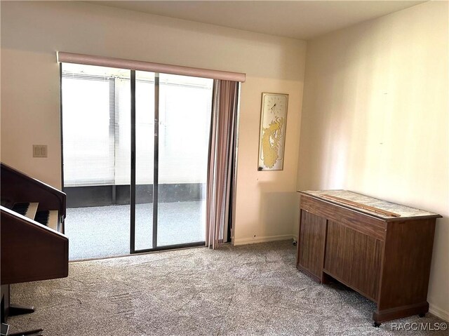 bedroom with a textured ceiling, carpet floors, and ceiling fan