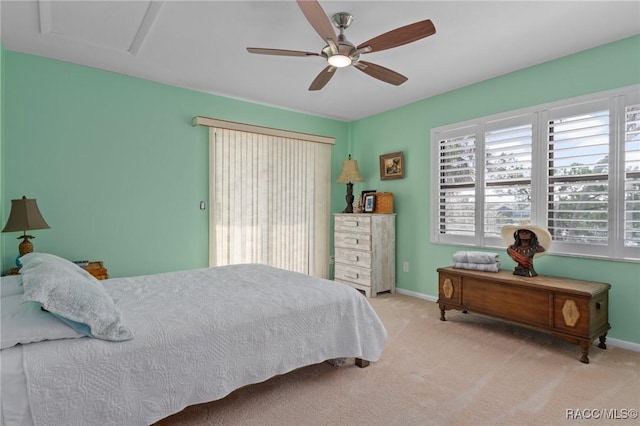 bedroom with ceiling fan and light carpet