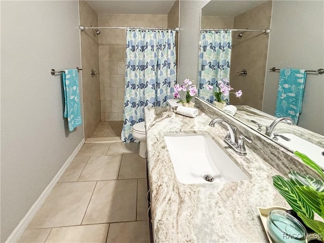 bathroom featuring a stall shower, baseboards, toilet, tile patterned floors, and vanity