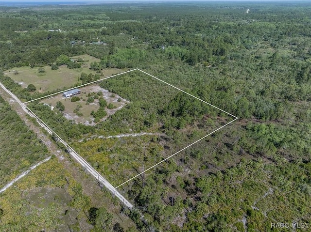 aerial view featuring a view of trees