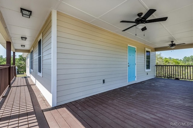 wooden deck featuring a ceiling fan