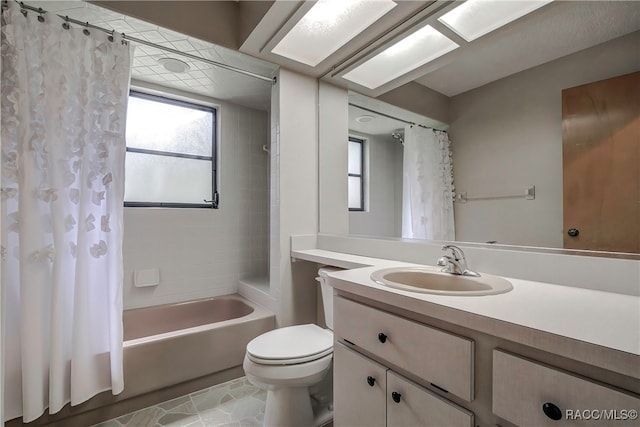 full bathroom featuring tile patterned flooring, vanity, toilet, and shower / bathtub combination with curtain