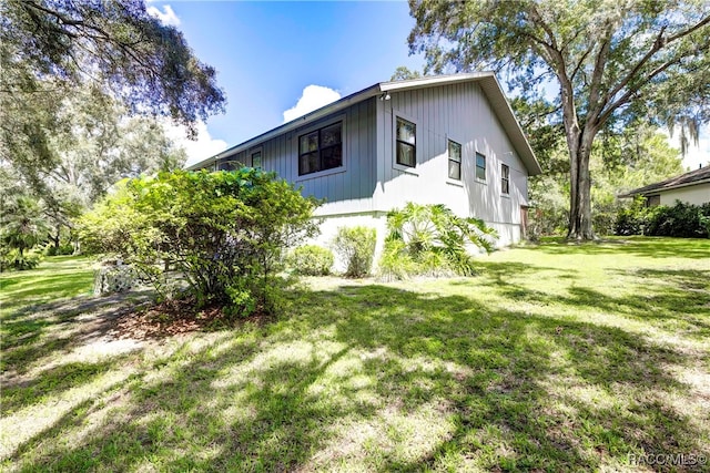 view of home's exterior featuring a yard