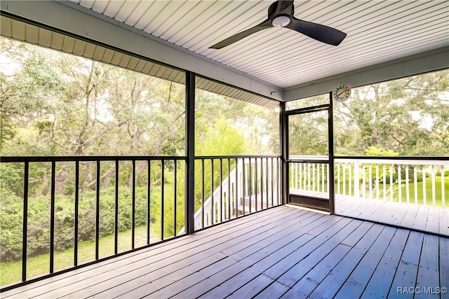 unfurnished sunroom with ceiling fan and a wealth of natural light