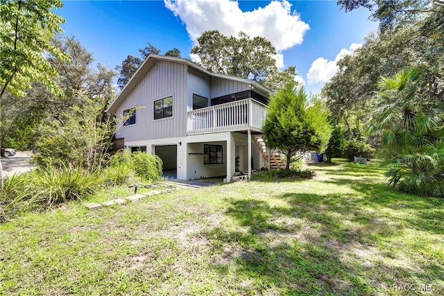 back of house featuring a lawn and a patio