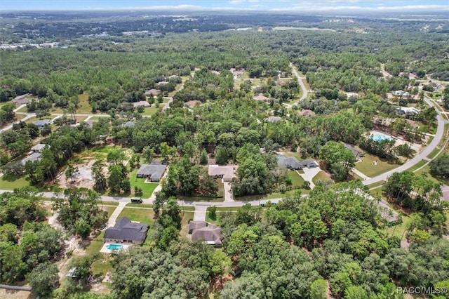 2494 W Axelwood Dr, Beverly Hills, FL 34465 - birds eye view of property with a wooded view
