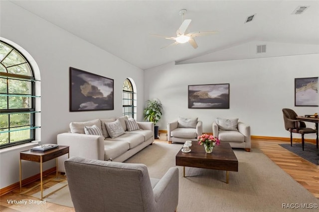 2494 W Axelwood Dr, Beverly Hills, FL 34465 - living room with visible vents, vaulted ceiling, and wood finished floors