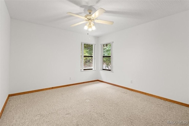 2494 W Axelwood Dr, Beverly Hills, FL 34465 - carpeted spare room featuring a ceiling fan, a textured ceiling, and baseboards