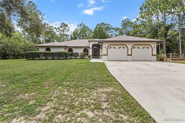 ranch-style home featuring an attached garage, concrete driveway, a front yard, and stucco siding