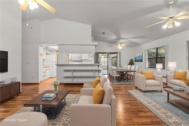2494 W Axelwood Dr, Beverly Hills, FL 34465 - living area featuring light wood-style floors, ceiling fan, and vaulted ceiling