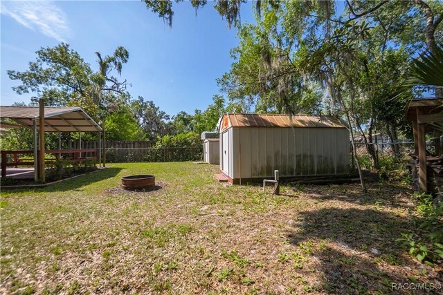 728 S Juniper Way, Inverness, FL 34450 - view of yard featuring a fire pit