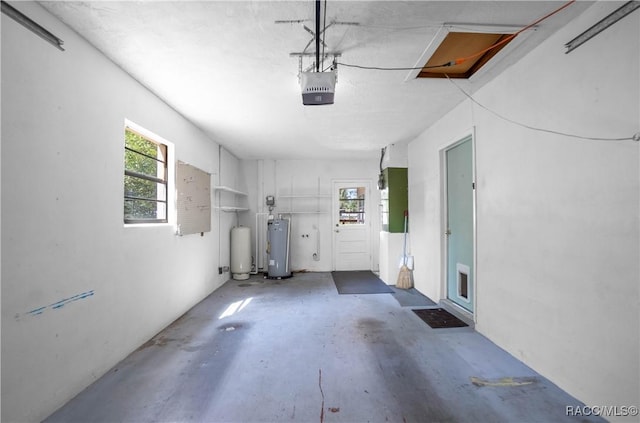 728 S Juniper Way, Inverness, FL 34450 - garage with gas water heater and a garage door opener