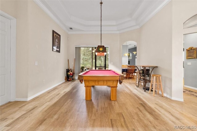 playroom with arched walkways, light wood finished floors, a raised ceiling, billiards, and baseboards