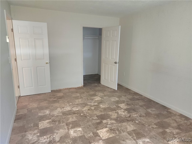 unfurnished bedroom with a closet