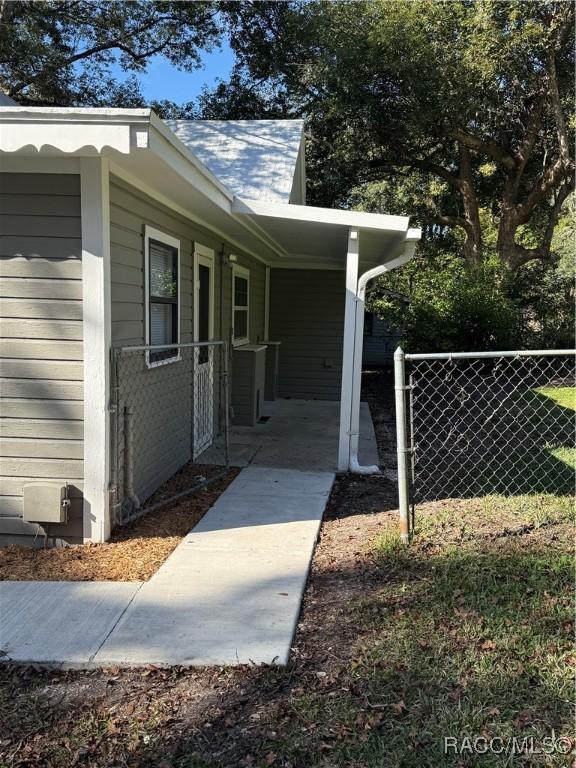 view of home's exterior with a carport