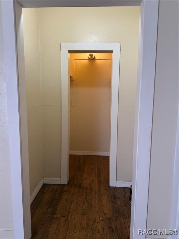 hallway featuring dark hardwood / wood-style floors