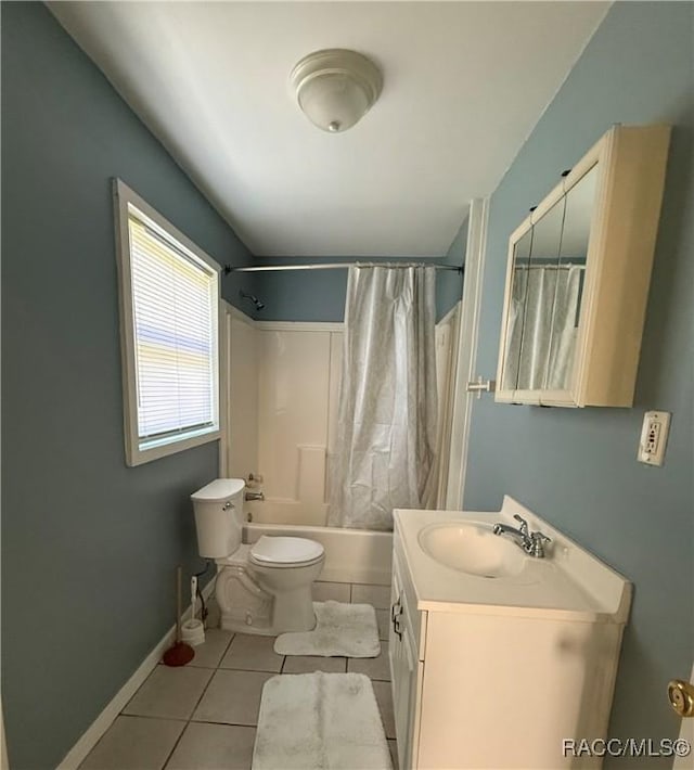 full bathroom featuring tile patterned floors, shower / bath combination with curtain, toilet, and vanity