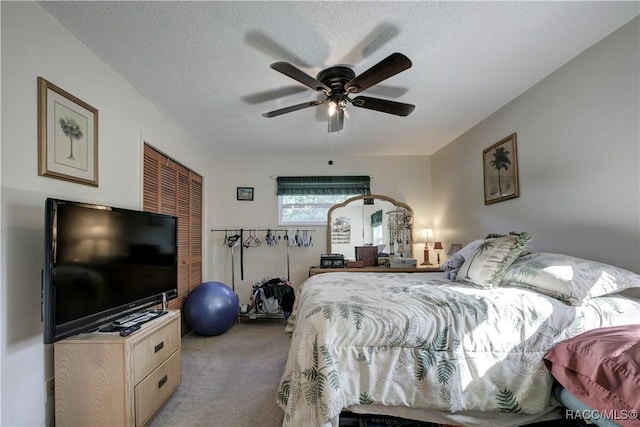2191 S Moonlit Pt, Homosassa, FL 34448 - bedroom featuring carpet flooring, a closet, a textured ceiling, and a ceiling fan