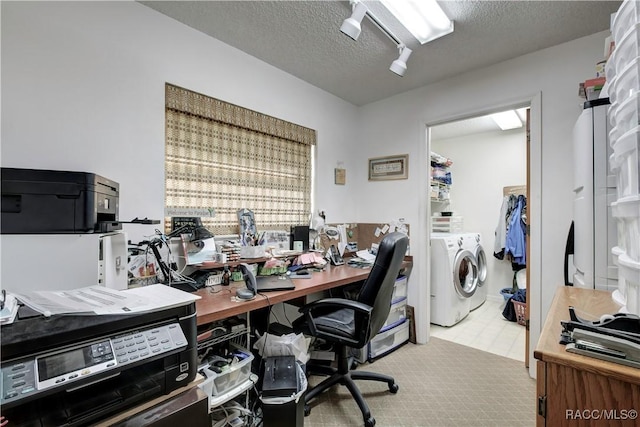 2191 S Moonlit Pt, Homosassa, FL 34448 - office with washer and clothes dryer and a textured ceiling