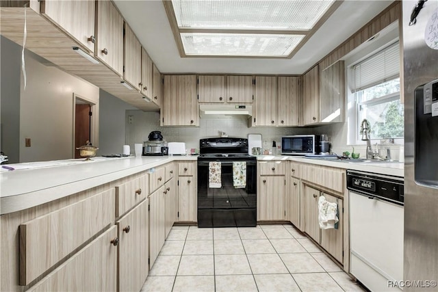 2191 S Moonlit Pt, Homosassa, FL 34448 - kitchen featuring white dishwasher, black electric range oven, under cabinet range hood, a sink, and light countertops