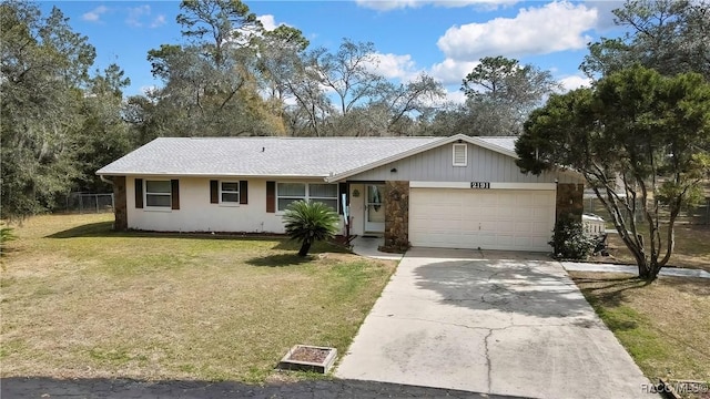 2191 S Moonlit Pt, Homosassa, FL 34448 - ranch-style house with a garage, driveway, a front lawn, and stone siding