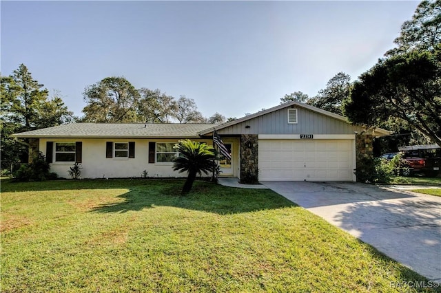 2191 S Moonlit Pt, Homosassa, FL 34448 - ranch-style home with an attached garage, concrete driveway, a front lawn, stone siding, and stucco siding