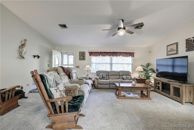 2191 S Moonlit Pt, Homosassa, FL 34448 - living room with carpet floors, a ceiling fan, and vaulted ceiling