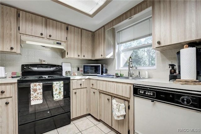 2191 S Moonlit Pt, Homosassa, FL 34448 - kitchen featuring white dishwasher, electric range, under cabinet range hood, stainless steel microwave, and light countertops