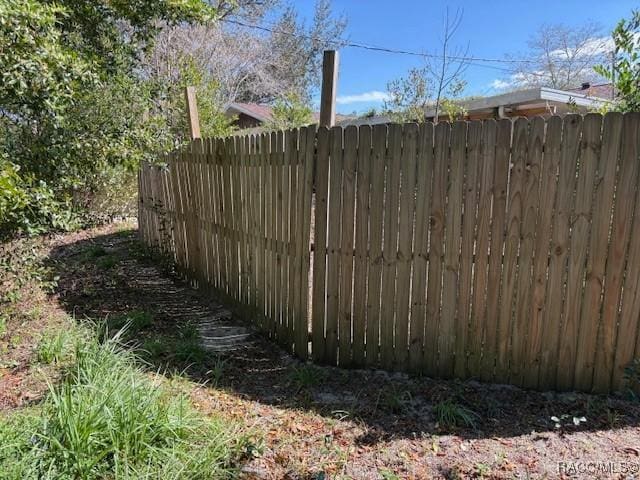 view of gate featuring fence