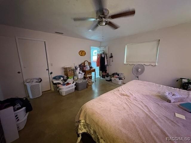 bedroom with ceiling fan and visible vents