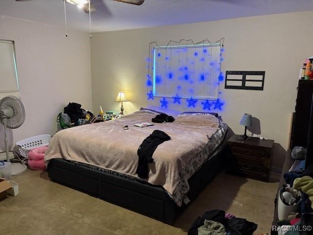 carpeted bedroom with a ceiling fan