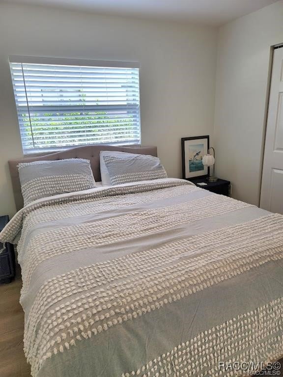 bedroom featuring hardwood / wood-style flooring