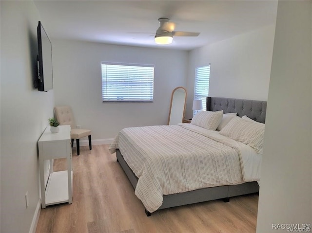 bedroom featuring ceiling fan and light hardwood / wood-style flooring