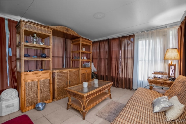 living area with light tile patterned floors