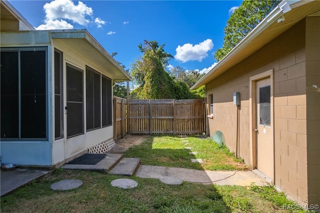 view of yard featuring a sunroom