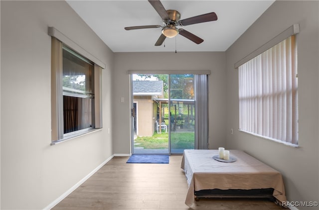 dining space with light wood-type flooring, a wealth of natural light, and ceiling fan